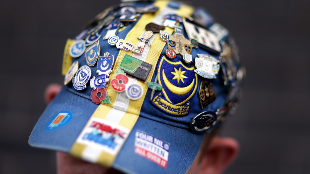 Portsmouth fan's cap covered with badges
