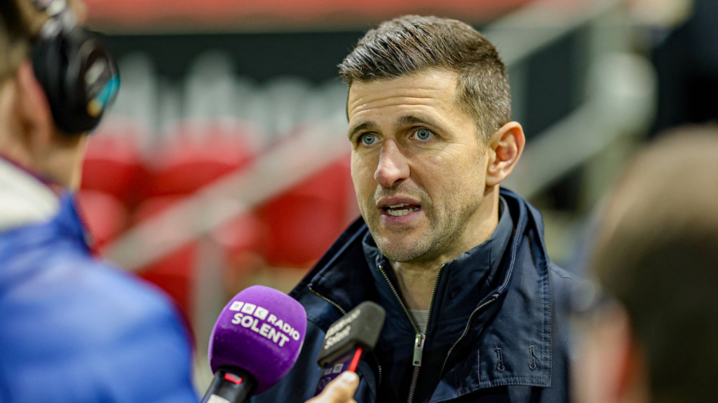 John Mousinho being interviewed