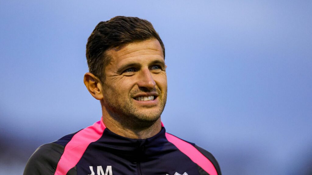 Portsmouth manager John Mousinho watches on through gritted teeth.