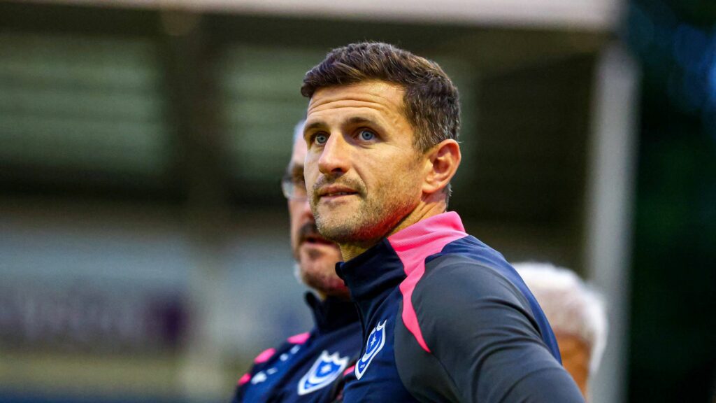 Portsmouth manager John Mousinho watches on