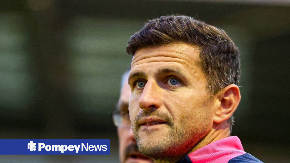 Portsmouth manager John Mousinho watches on