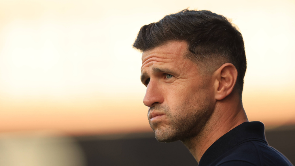 Portsmouth manager John Mousinho looks on