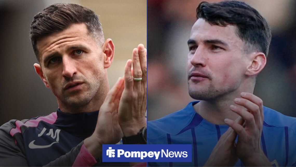 John Mousinho claps, alongside Regan Poole smiling
