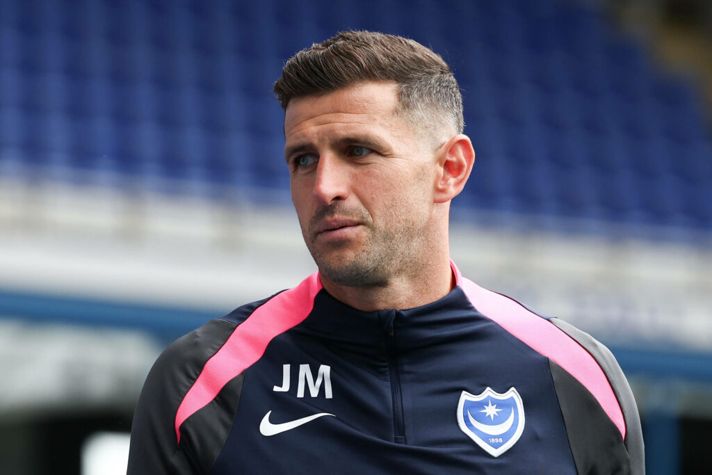 John Mousinho in Portsmouth jacket during pre-season fixture against Reading