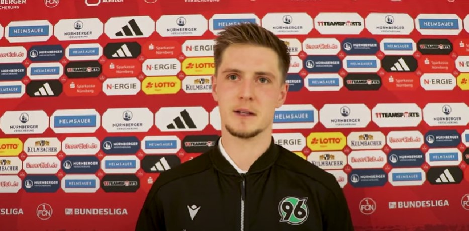 Josh Knight in Hannover training shirt being interviewed