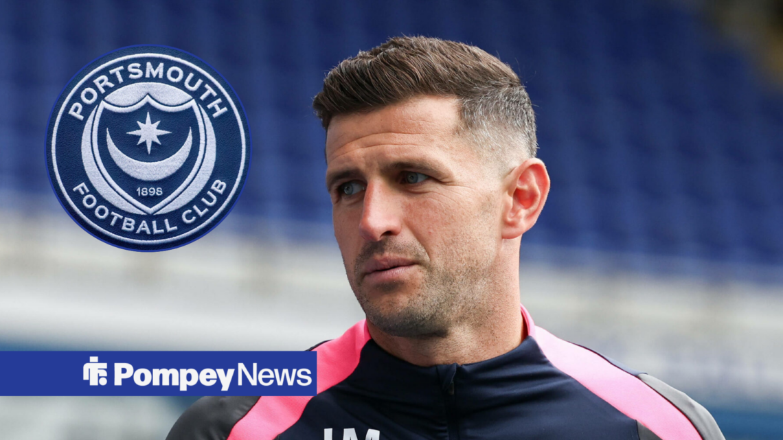 John Mousinho looking at Portsmouth badge in circle