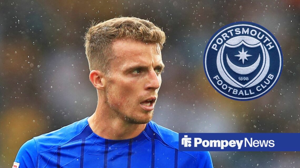Conor Shaughnessy looking at Portsmouth badge in circle