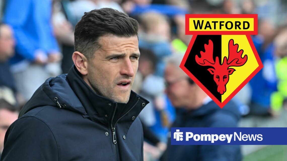 John Mousinho looks on, with a Watford badge next to him