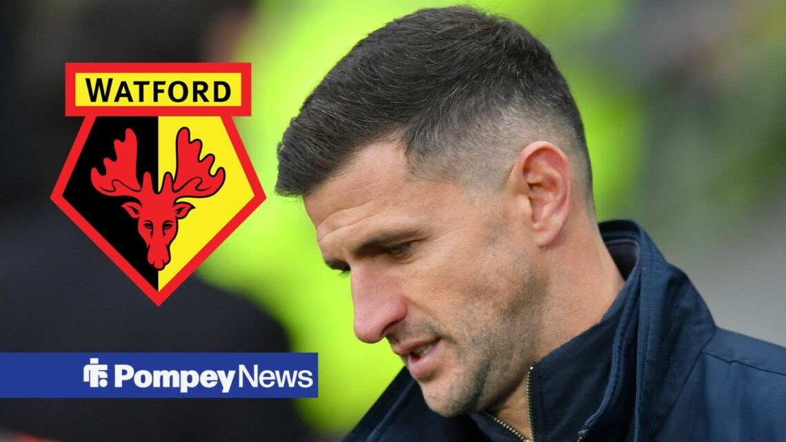John Mousinho looking down with Watford badge on left