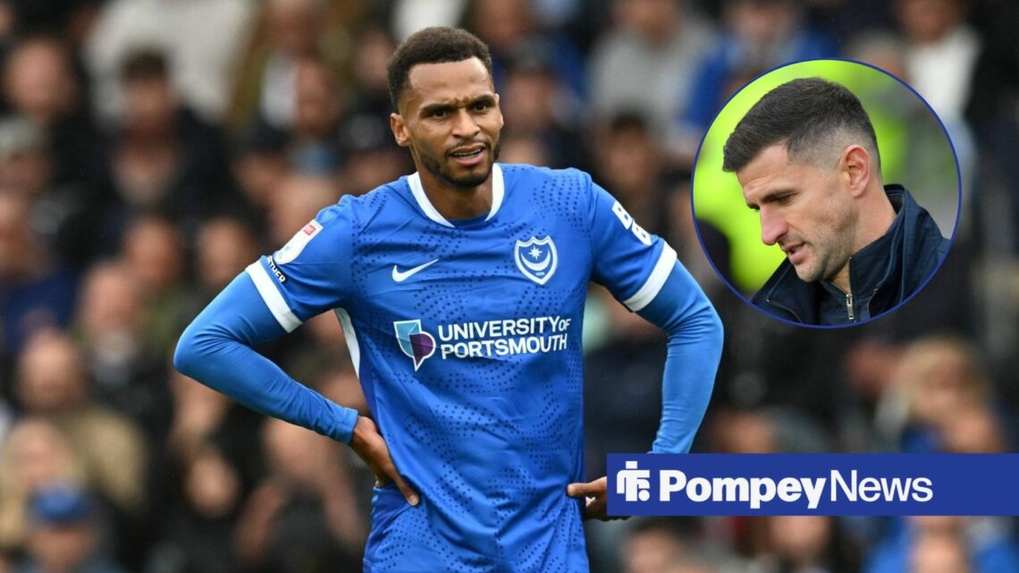 Josh Murphy with arms on hips with John Mousinho in circle