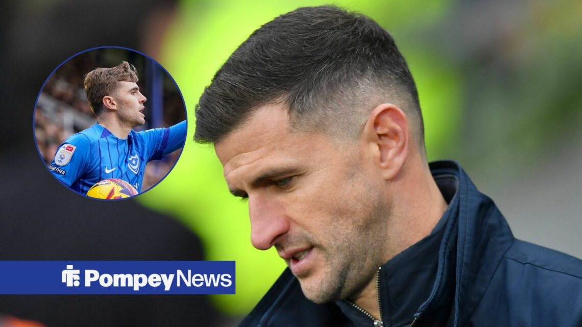 John Mousinho looking down with Zak Swanson in circle