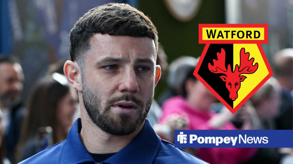 Conor Chaplin looking at Watford badge