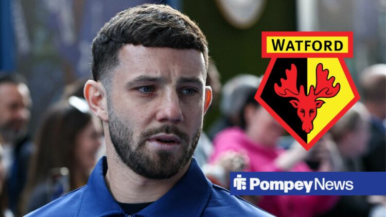 Conor Chaplin looking at Watford badge