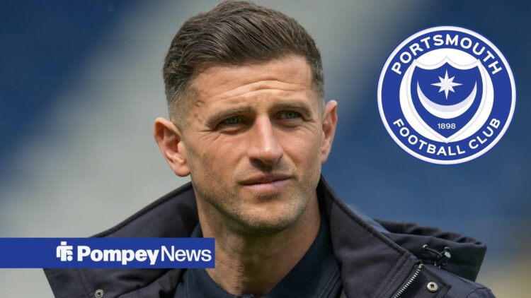 John Mousinho in black jacket with Portsmouth badge in circular inset