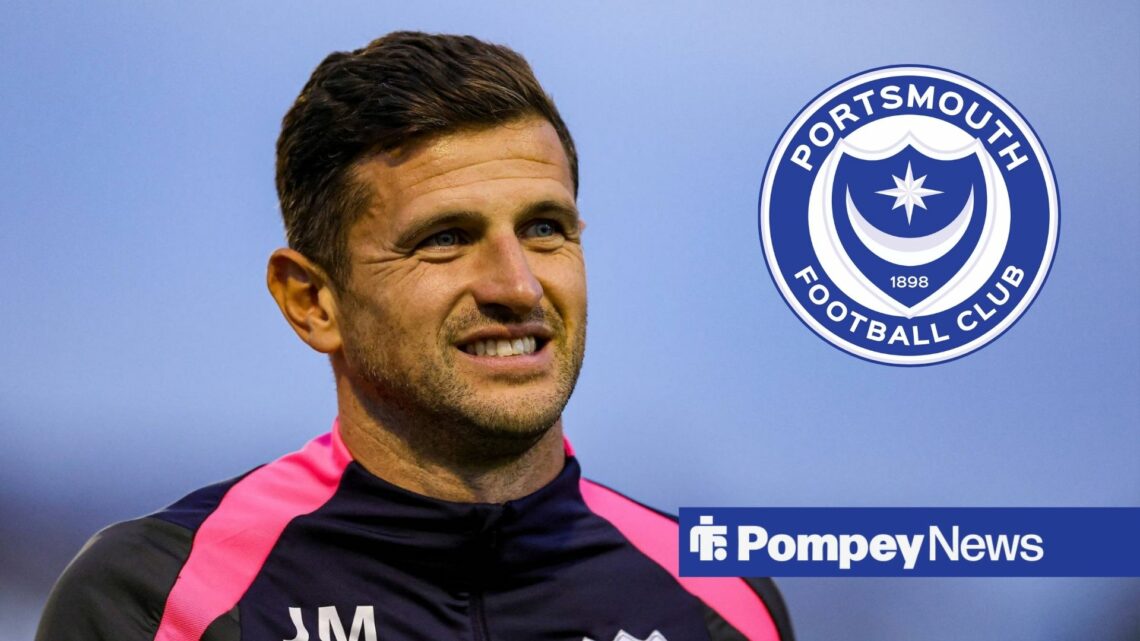 John Mousinho smiling with Portsmouth badge in circular inset