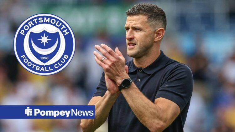 John Mousinho in polo shirt clapping with Portsmouth badge in circular inset
