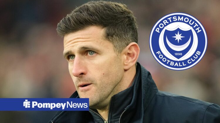 John Mousinho looking concerned with Portsmouth badge in circular inset