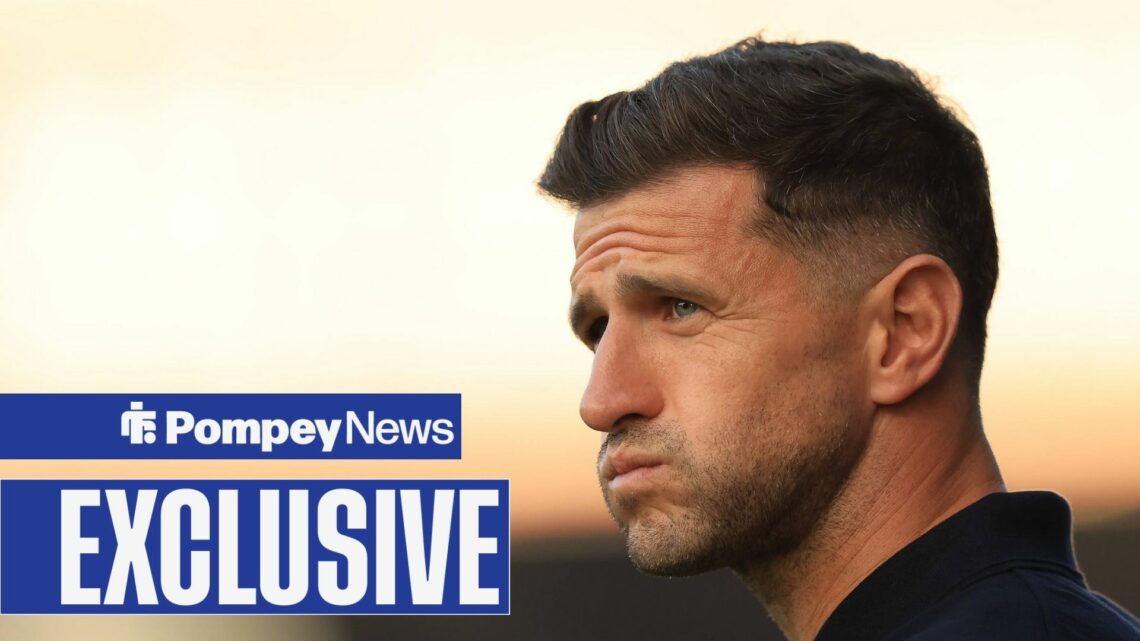 John Mousinho looking worried with exclusive tag