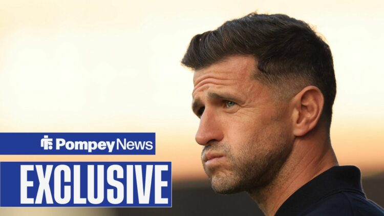 John Mousinho looking worried with exclusive tag