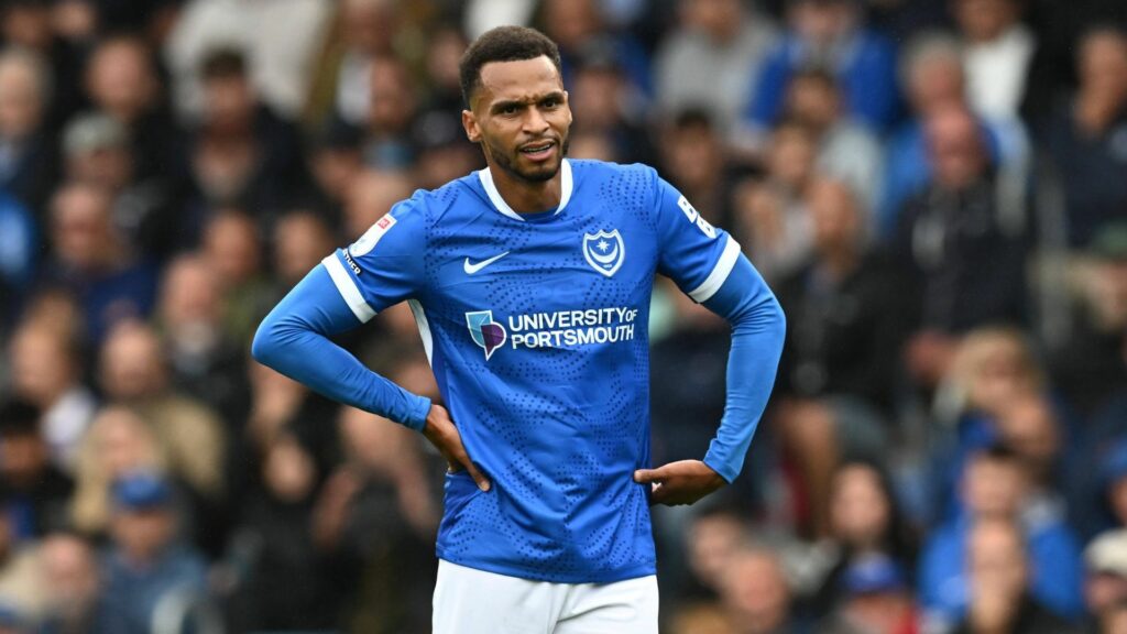 Josh Murphy with his hands by his side playing for Portsmouth