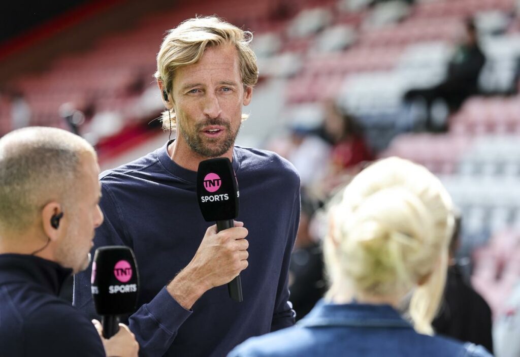 Peter Crouch holding a microphone