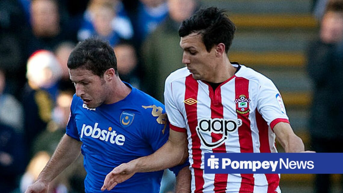 David Norris in Portsmouth home shirt battles with Southampton