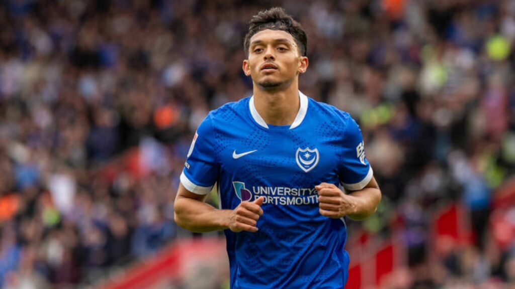 Andre Dozzell playing in Portsmouth home shirt
