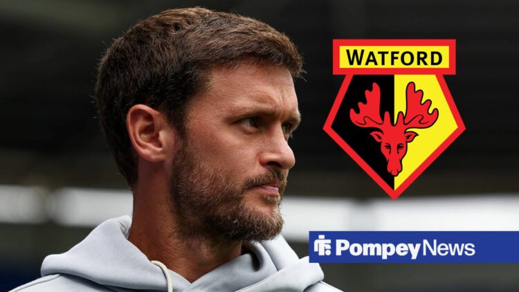 John Swift looking at Watford badge