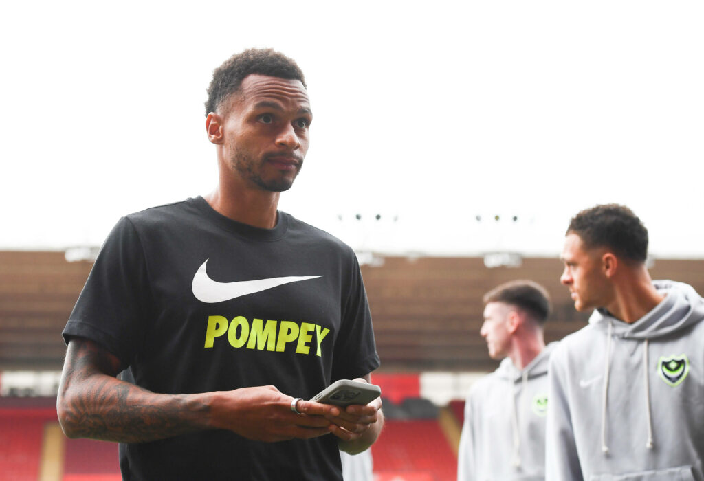 Josh Murphy on his phone ahead of a Portsmouth match