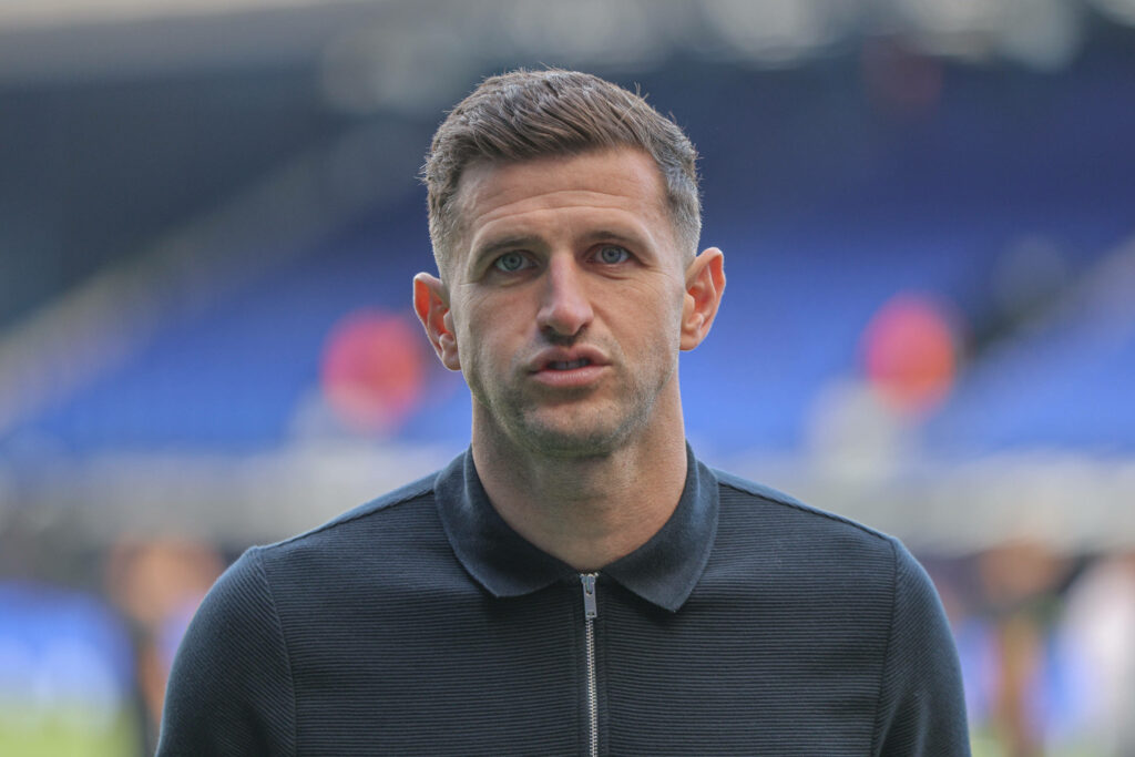 John Mousinho pulls a face